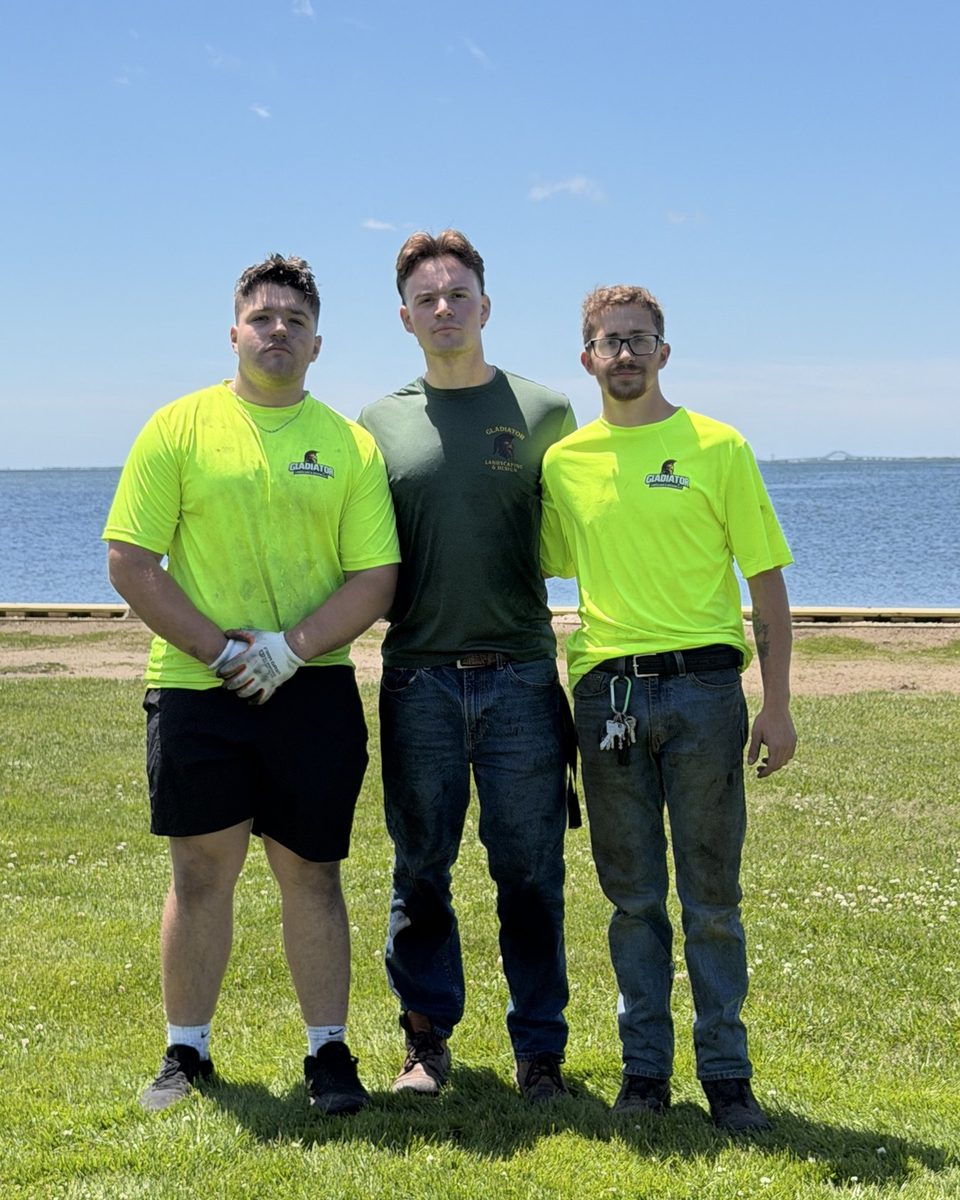 The Gladiator Landscaping & Design crew in branded shirts on Long Island