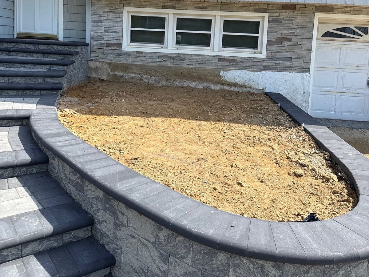 New paver planter wall before plantings