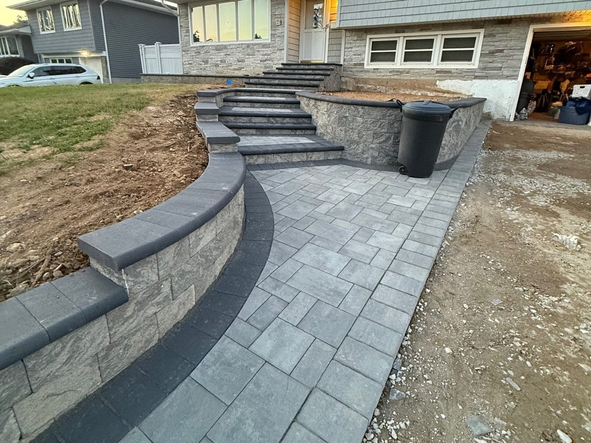 Paver retaining wall and steps at dusk