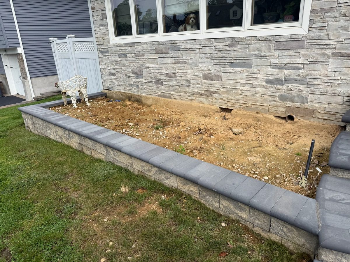 Front planter bed bare before mulch and plantings